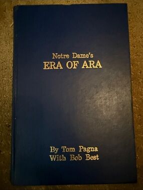 Notre Dame's ERA OF ARA Hardcover Book in Navy Blue with Gold Lettering